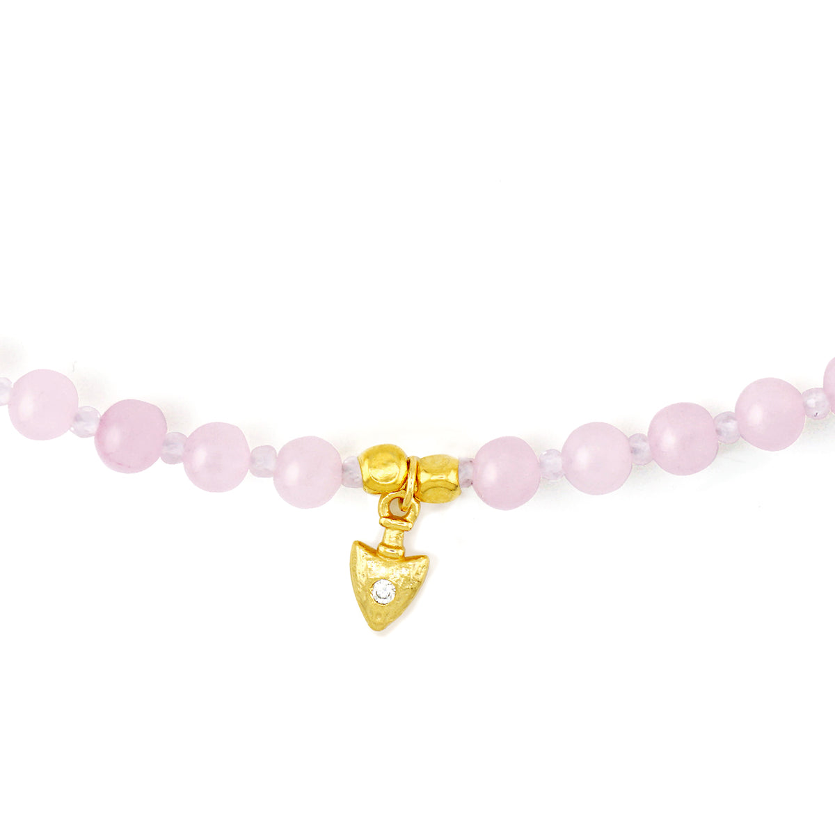 Close up detail of 18k gold plated S925 silver CZ arrow charm on natural pink gemstone beads
