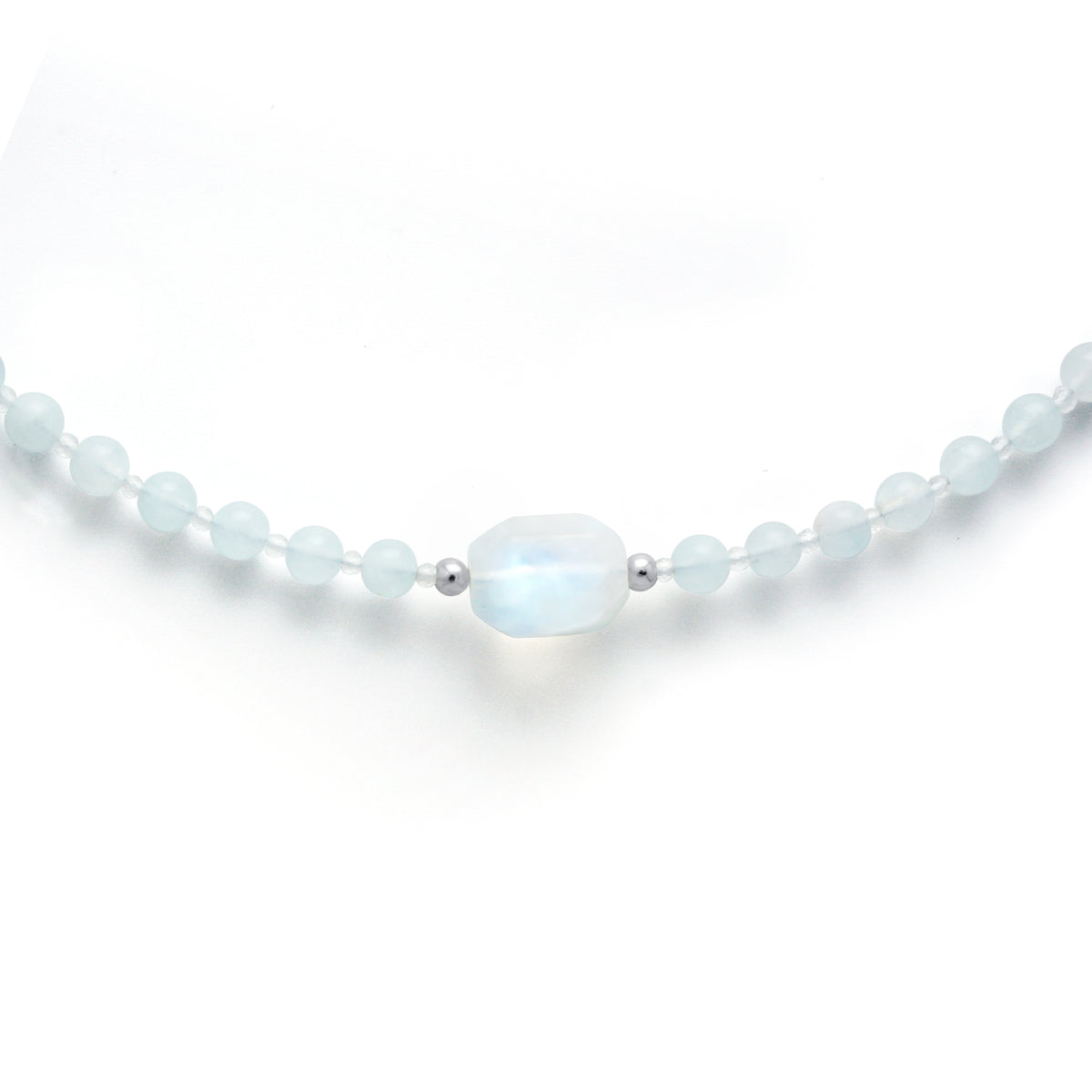 Close up detail of natural Rainbow Moonstone focal bead on light blue Aquamarine beads with S925 silver spacers
