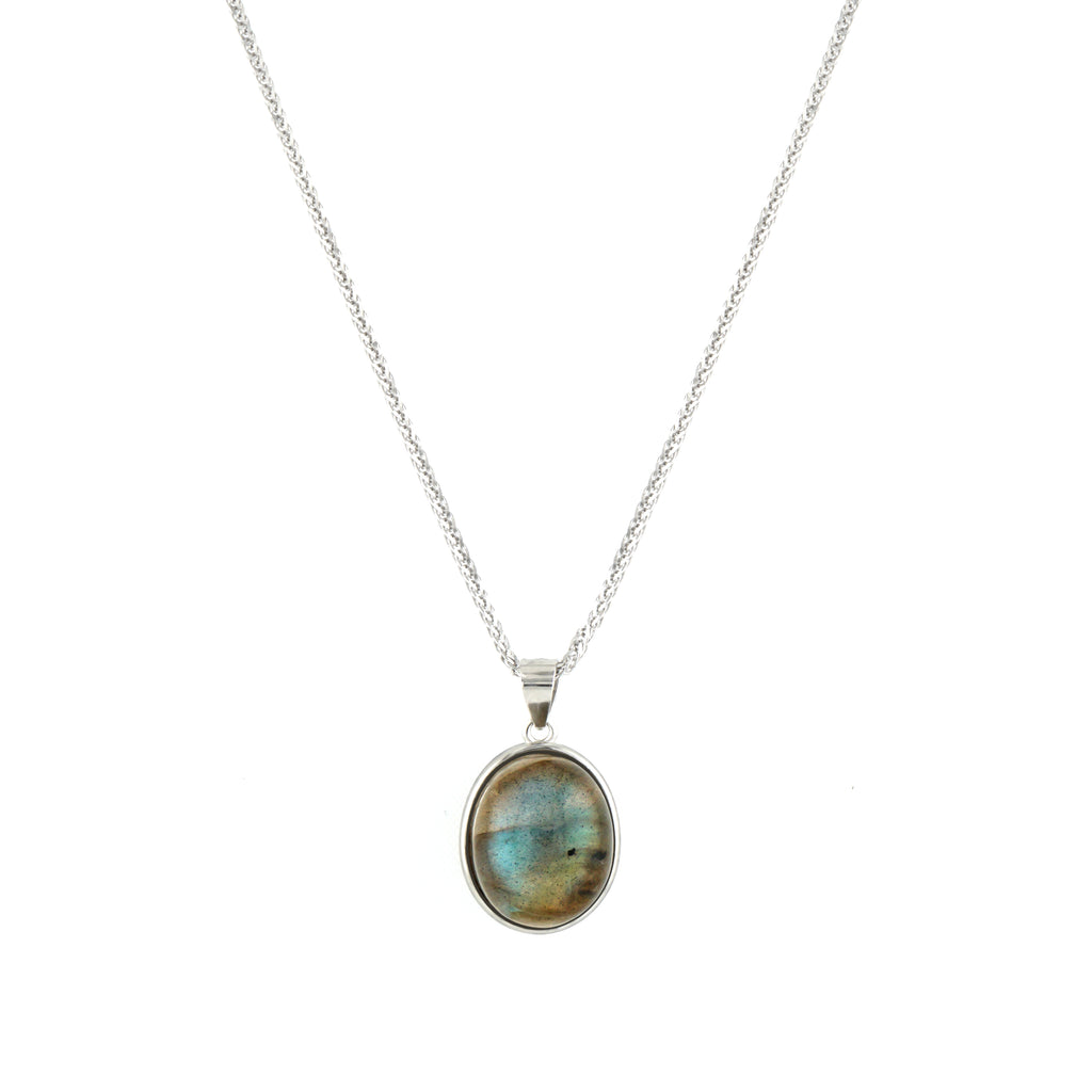 A silver chain necklace with an oval pendant featuring a natural labradorite stone with iridescent blue, green, and gold flecks, set in a silver bezel.