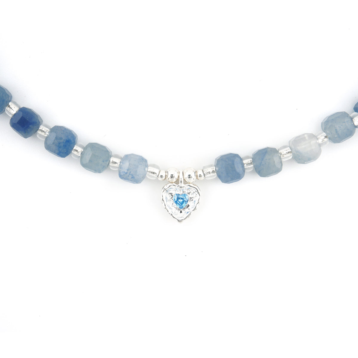 Close up detail of S925 silver textured heart charm with blue cubic zirconia on Blue Aventurine beads
