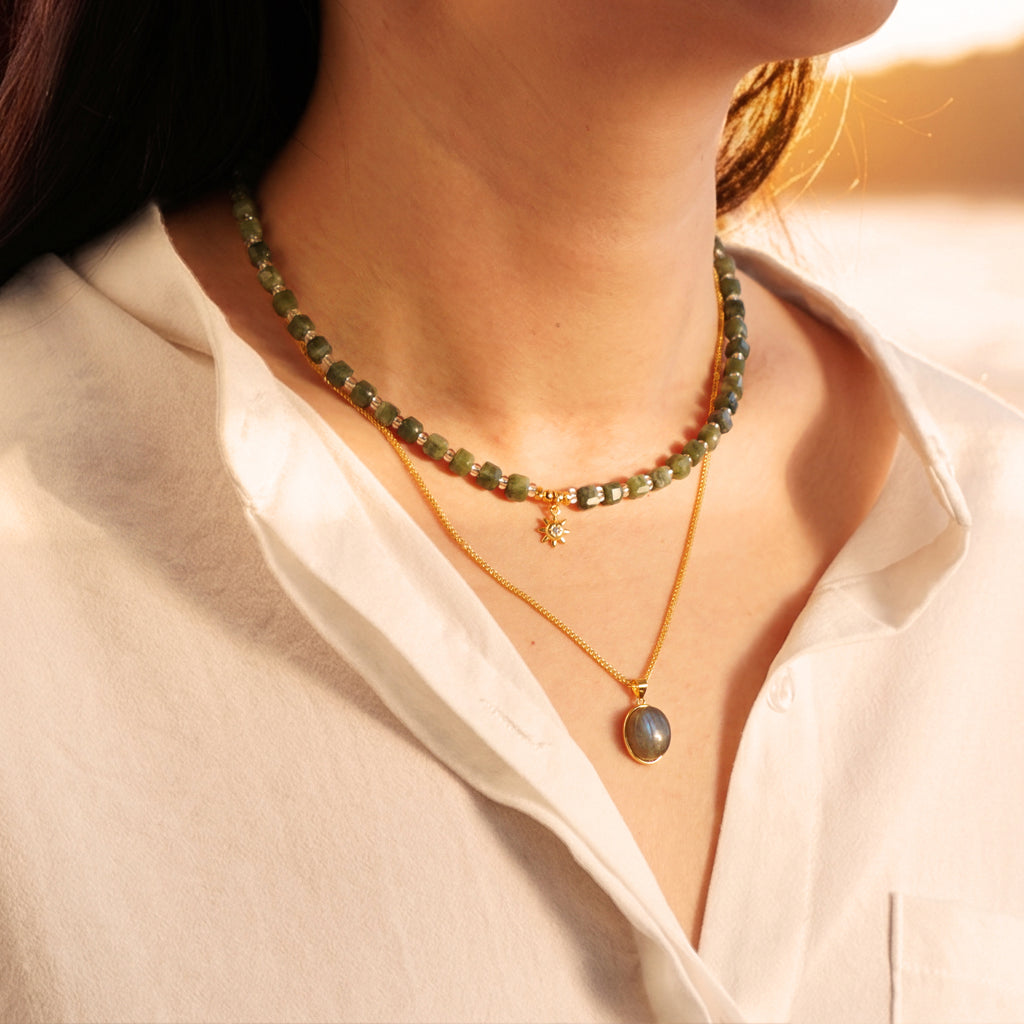 Layered natural Southern Jade sunburst choker and 50cm gold Labradorite pendant necklace set on model in golden sunlight
