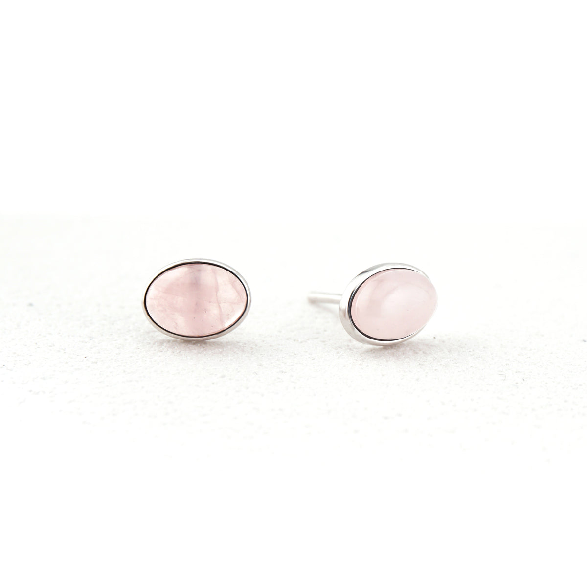 Pair of oval natural Rose Quartz cabochon stud earrings in S925 sterling silver bezel setting
